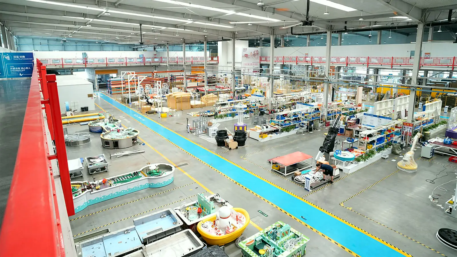DEEPBLUE manufacturing team working on systems included in a children's museum turnkey scope