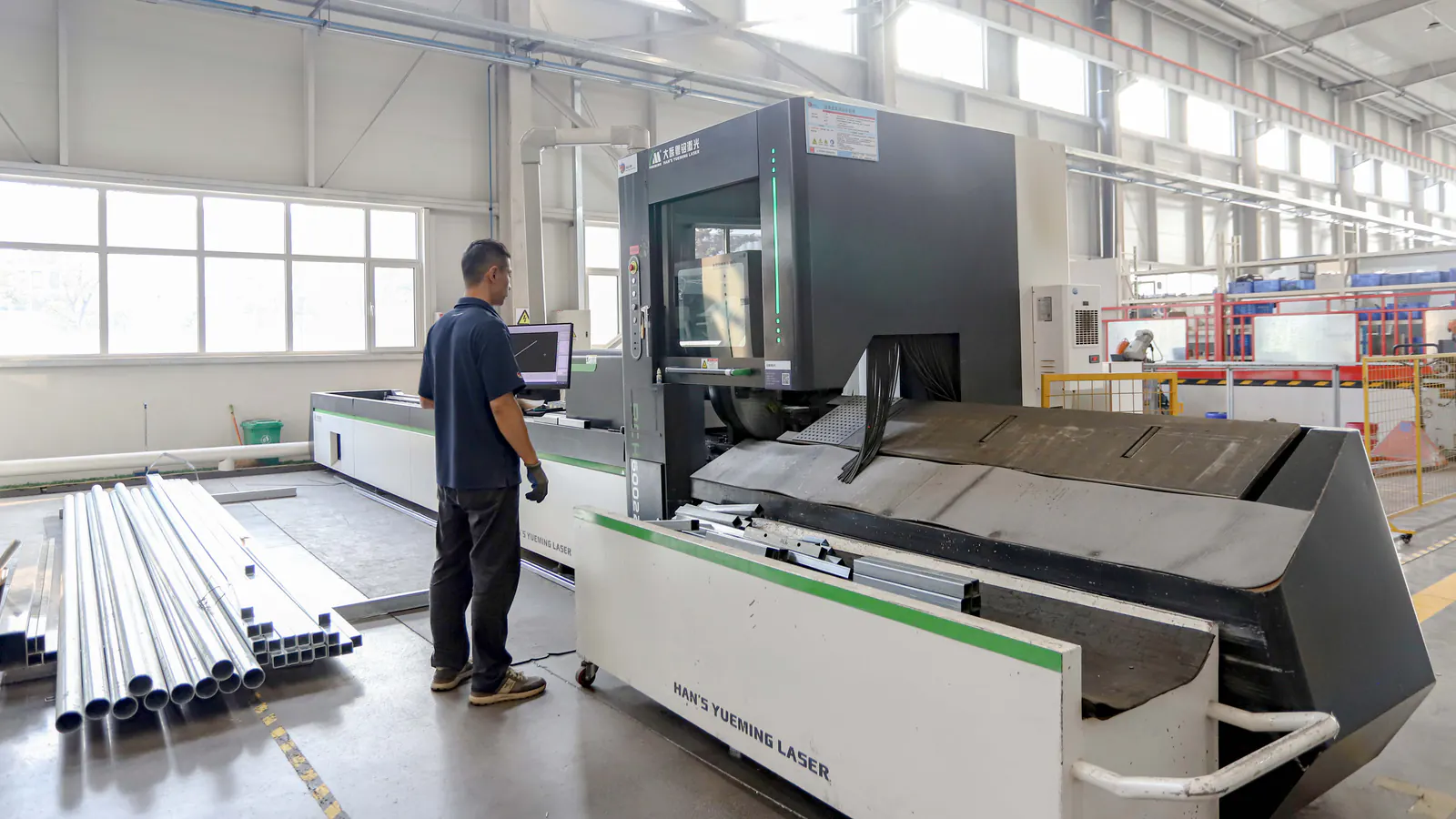 DEEPBLUE factory operator processing metal components for custom museum exhibit fabrication
